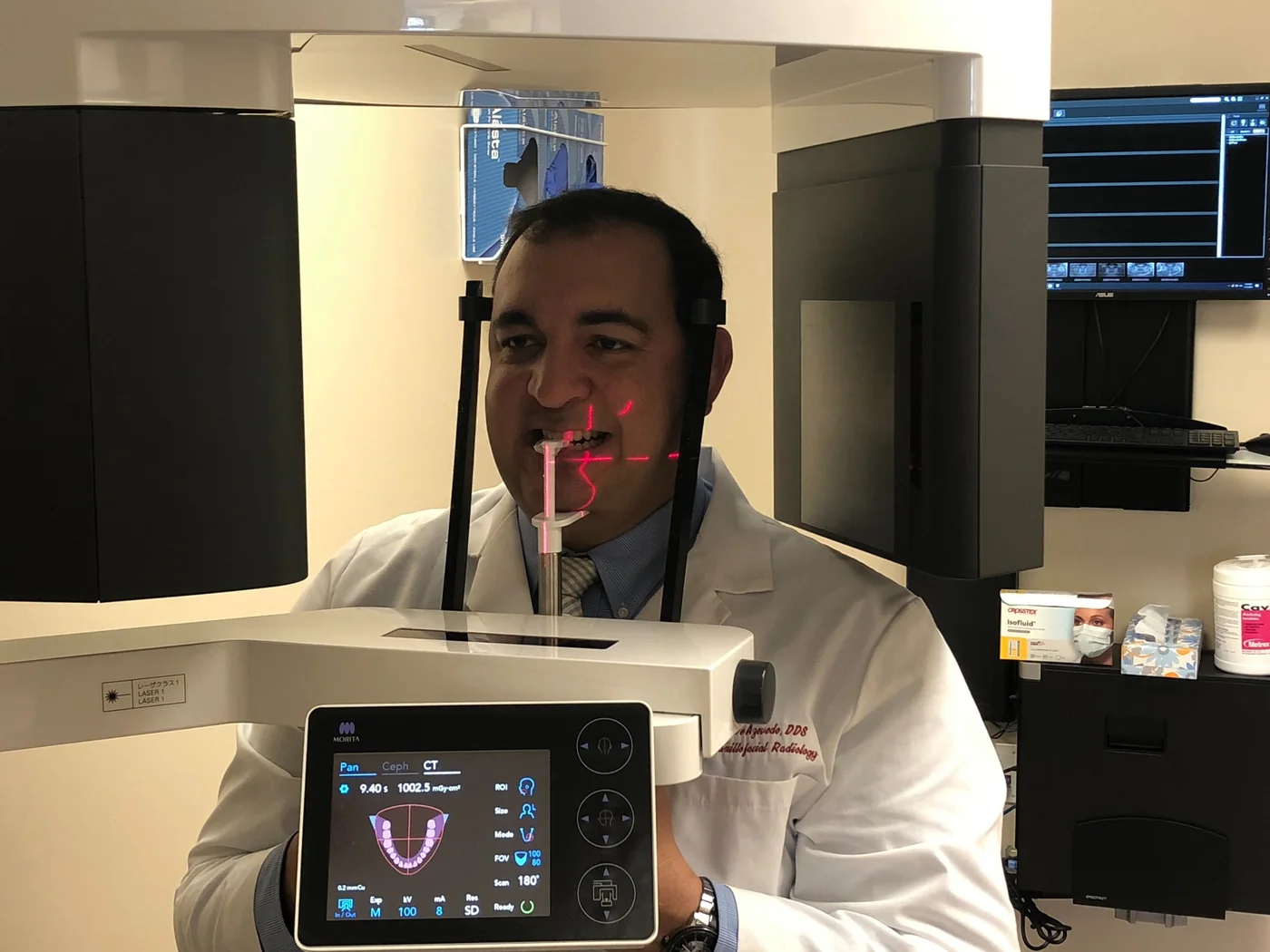 Dental team learning correct patient positioning and laser alignment on a J. Morita CBCT scanner